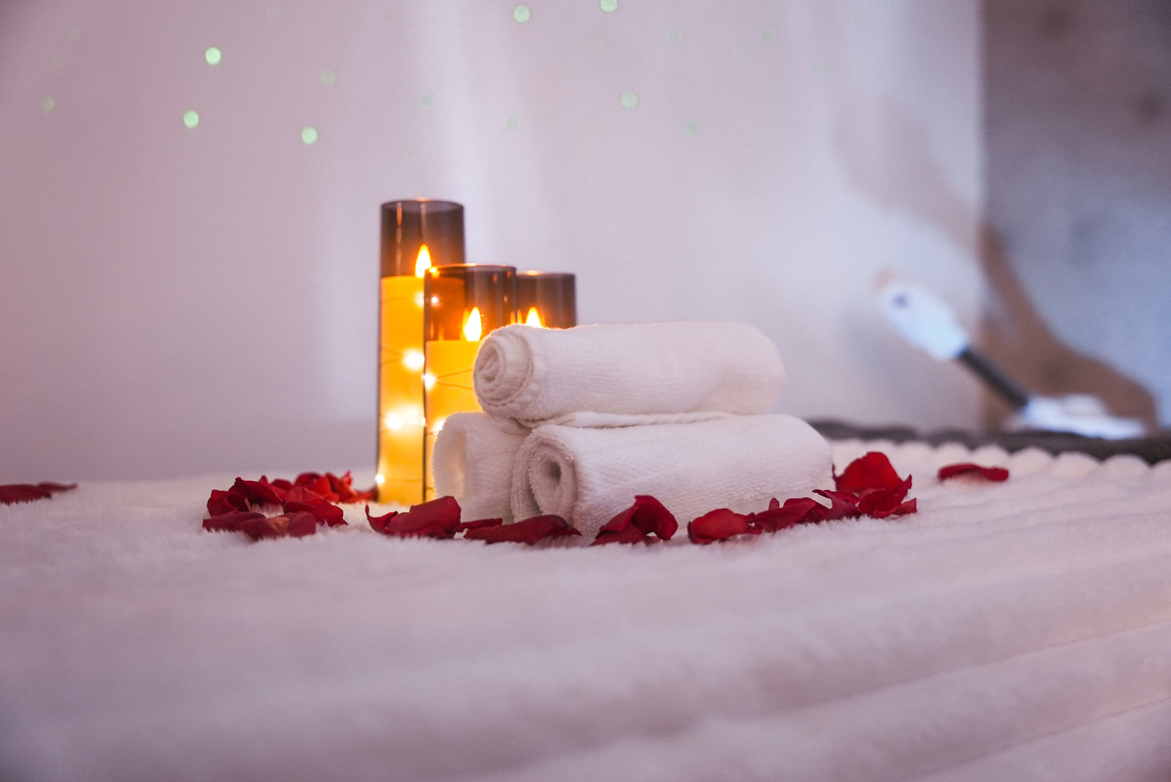 Spa towels and candles creating warm ambiance
